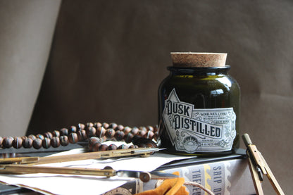 Dusk Distilled 8oz Soy wax wood-wick candle in green jar